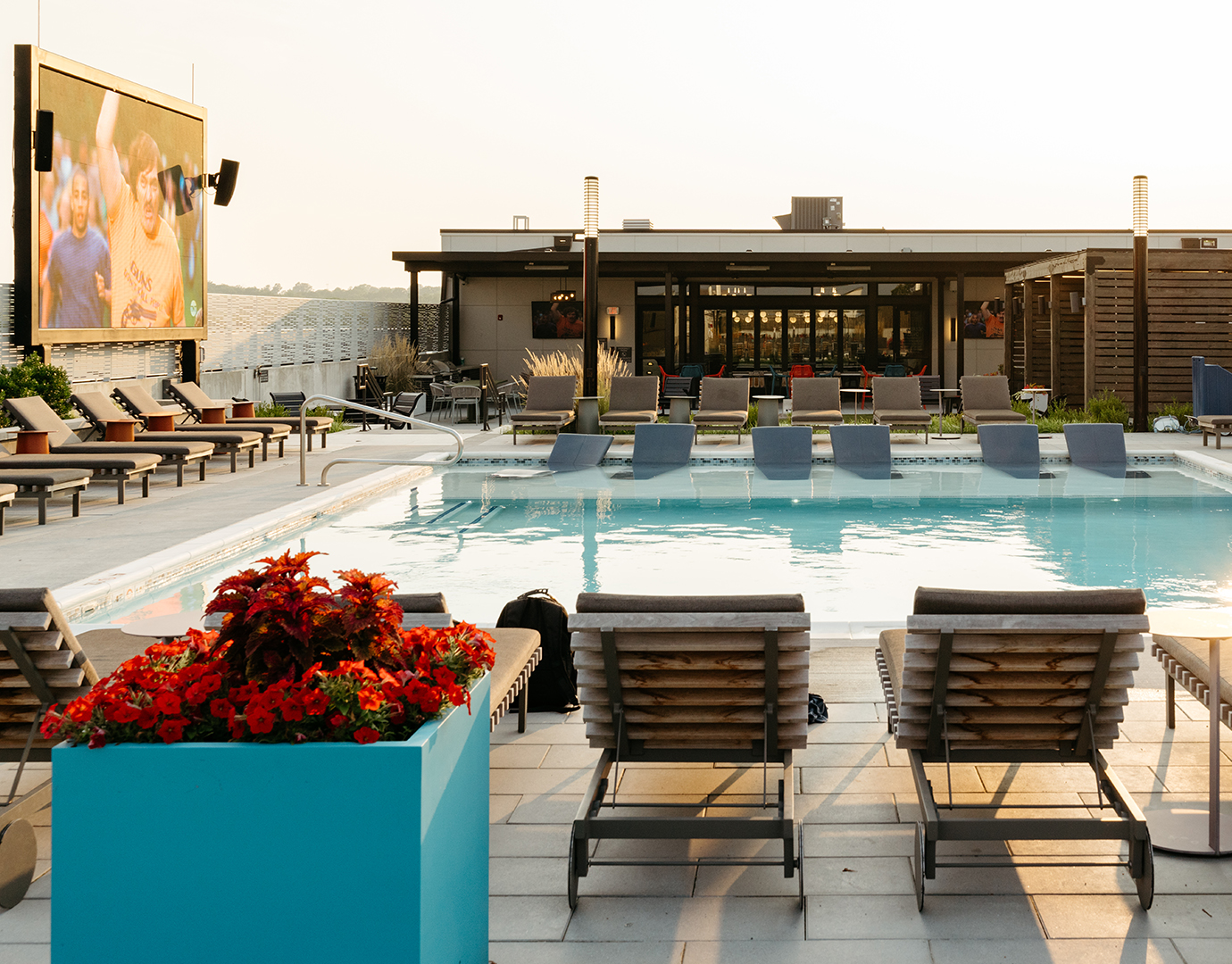 A swimming pool with poolside seating
