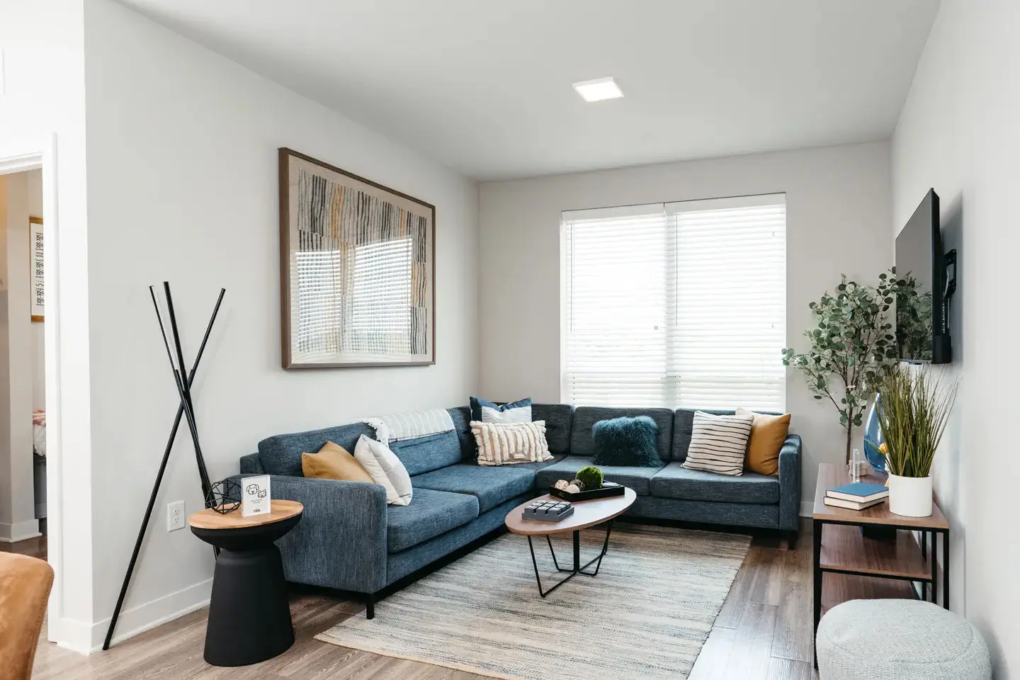 fully-furnished apartment living room with couch and coffee table.