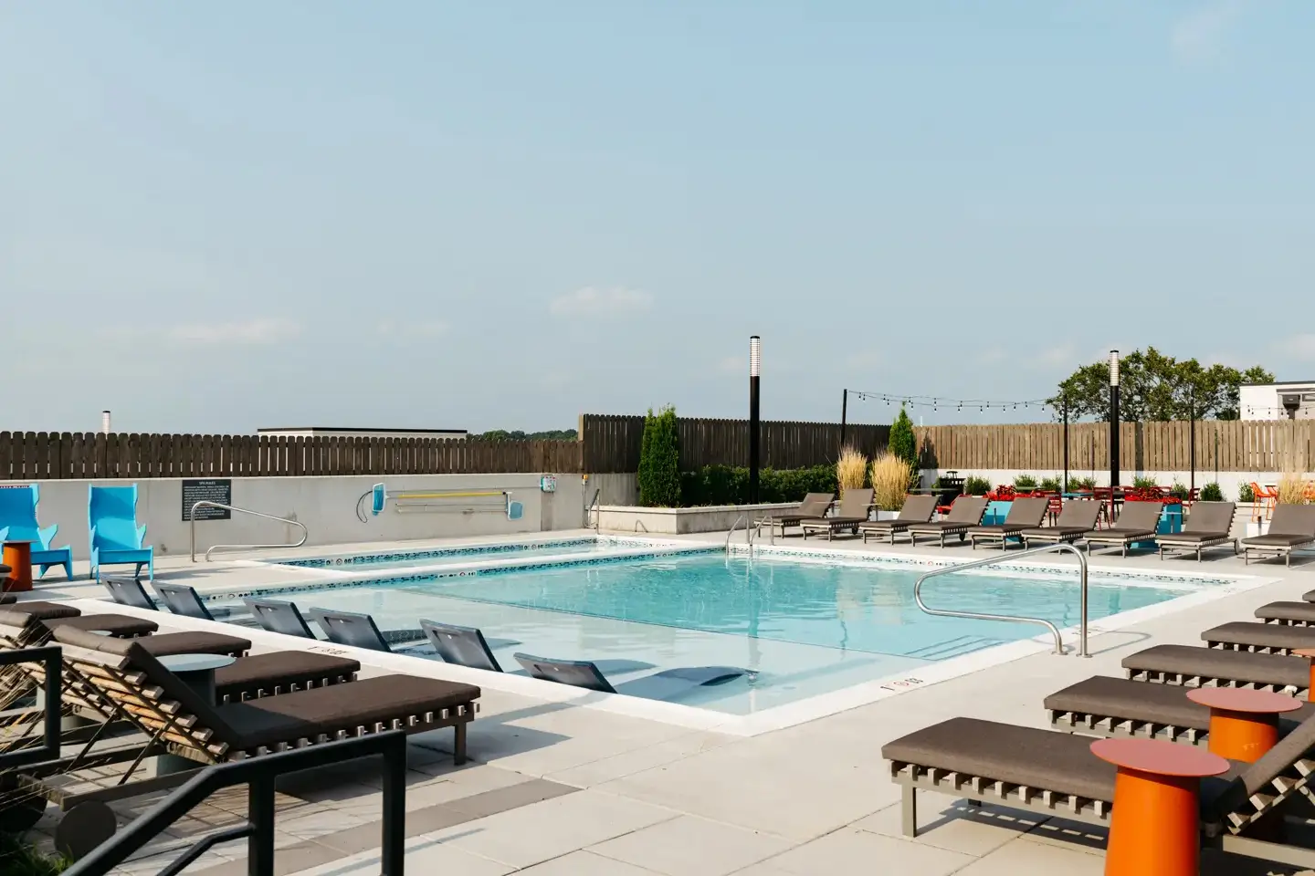 Rooftop pool with lounge seating